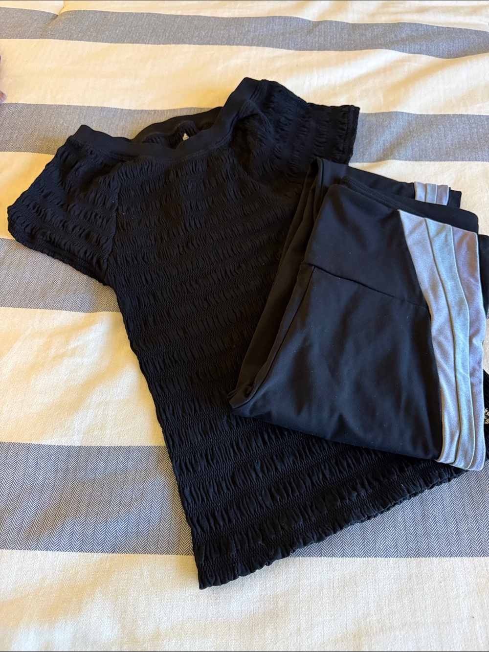Noli Black Leggings with blue/gray stripe down left leg.